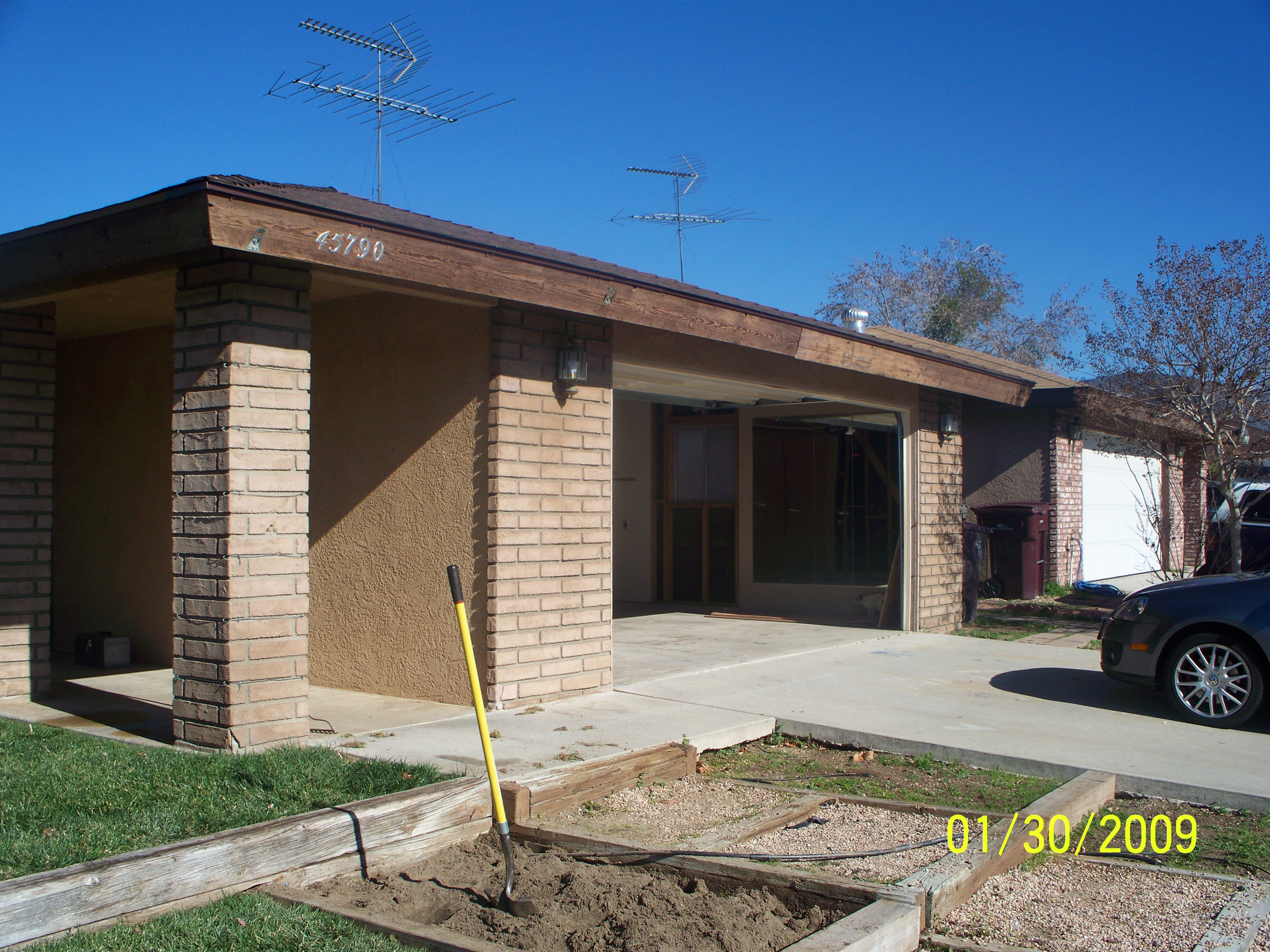 BEFORE - CUSTOMER REQUESTED REMOVAL OF BRICKS, REPAIR AND MATCH EXISTING FINISH.